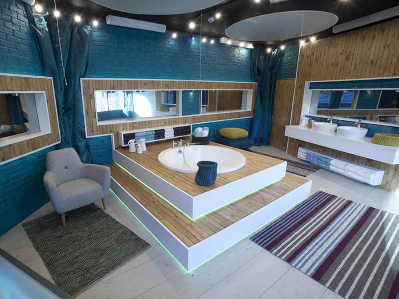 In this TV studio setting, the bath is inset into a raised wooden deck.